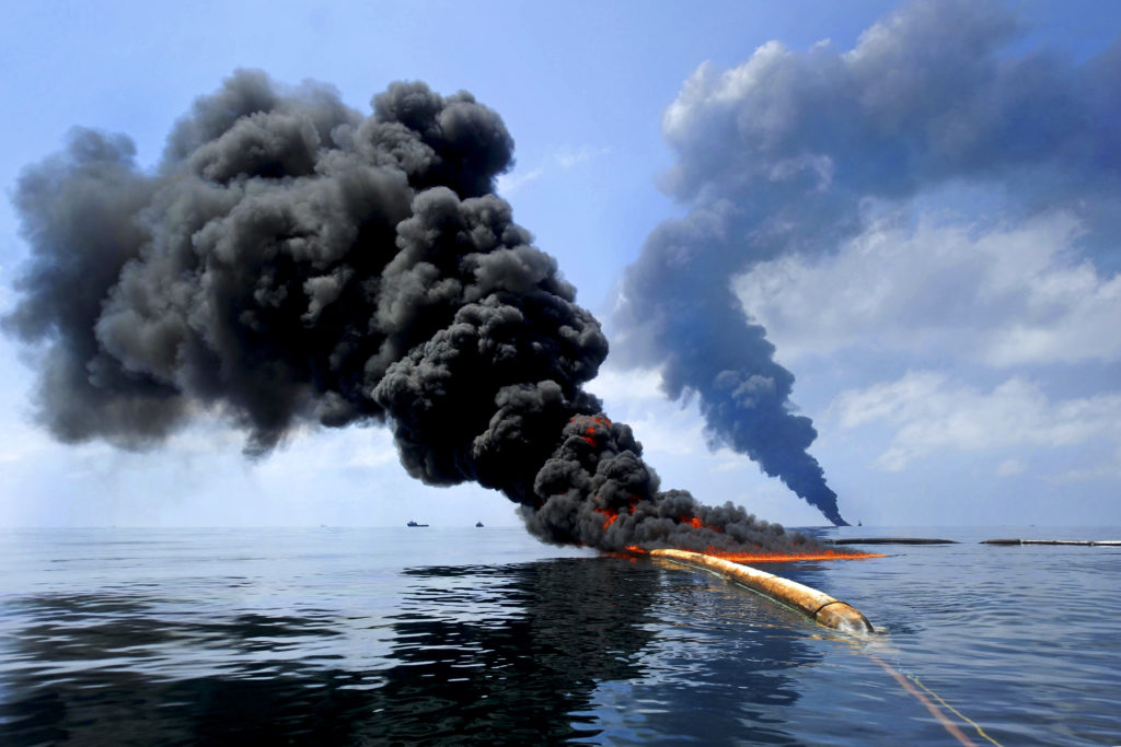 100506-N-6070S-819 Gulf of Mexico (May 6, 2010) -- Dark clouds of smoke and fire emerge as oil burns during a controlled fire in the Gulf of Mexico. The U.S. Coast Guard working in partnership with BP PLC, local residents, and other federal agencies conducted the "in situ burn" to aid in preventing the spread of oil following the April 20 explosion on Mobile Offshore Drilling Unit Deepwater Horizon. (U.S. Navy photo by Mass Communication Specialist 2nd Class Justin Stumberg/Released)